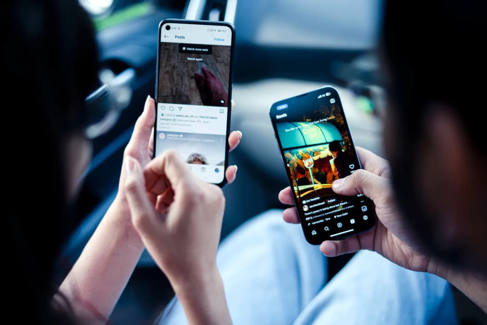 Two people scrolling social media on their phones